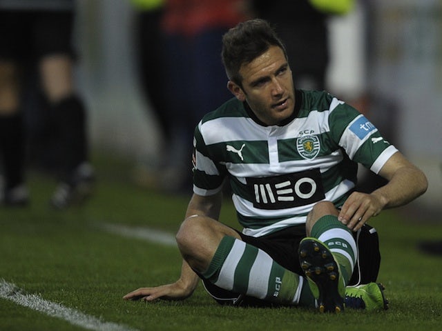 Sporting's Diego Capel sits dejected after a missed chance against Pacos Ferreira  on May 5, 2013