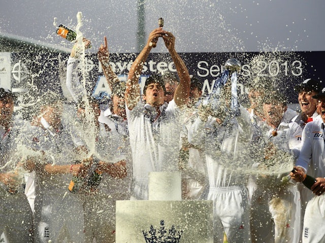 England skipper Alistair Cook holds the urn after his side secure the Ashes on August 25, 2013