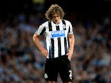 Newcastle's Fabricio Coloccini stands dejected with his side two down at Man City on August 19, 2013