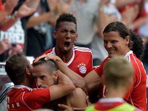 Bayern's Franck Ribery is congratulated by team mates after scoring against Nuremberg on August 24, 2013