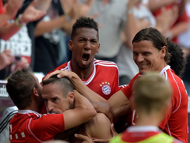 Bayern's Franck Ribery is congratulated by team mates after scoring against Nuremberg on August 24, 2013