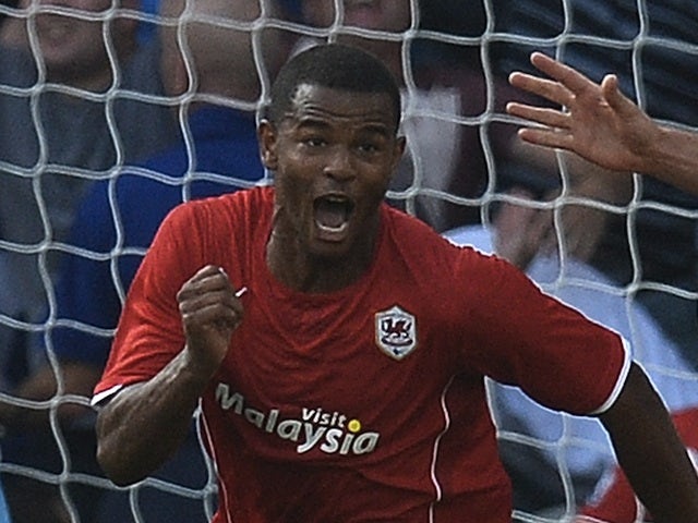 Cardiff striker Frazier Campbell wheels away to celebrate his goal against Man City on August 25, 2013