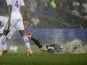 Reims forward Gaetan Courtet slides in the rain against Lyon on August 24, 2013