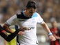 Gaston Sangoy (R) of Apollon Limassol dribbles past Kevin Gomis of OGC Nice (L) during the first leg of their UEFA Europa League qualifying football match in Limassol, Cyprus on August 22, 2013