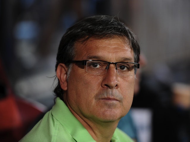 Barca boss Gerardo Martino in the dugout during the Super Cup game with Atletico Madrid on August 21, 2013