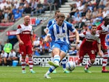 Wigan's Grant Holt scores the opening goal from the penalty spot during the match against Middlesbrough on August 25, 2013