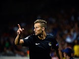 Real Sociedad's Haris Seferovic celebrates after scoring his team's second goal against Lyon on August 20, 2013