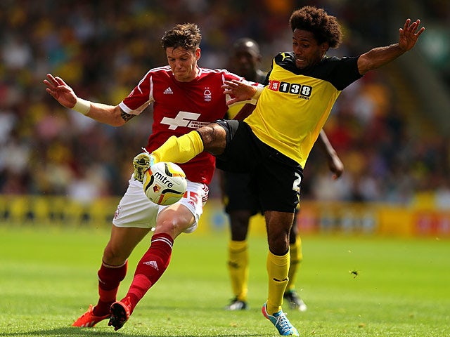 Watford's Ikechi Anya and Forest's Greg Halford battle for the ball on August 25, 2013