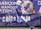 Jacob Lacey #27 of the Indianapolis Colts returns an interception for a touchdown during the Colts 27-13 victory over the Tennessee Titans in the NFL game at Lucas Oil Stadium on December 18, 2011