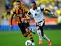 Hull's Jake Livermore and Norwich's Nathan Redmond battle for the ball on August 24, 2013