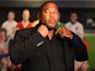 John Barnes prepares for a TV interview during the Football Association's Royal Mail Stamp Launch at Wembley Stadium on May 8, 2013 