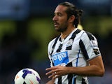 Jonas Gutierrez of Newcastle United takes a throw in during the Barclays Premier League match between Manchester City and Newcastle United at the Etihad Stadium on August 19, 2013