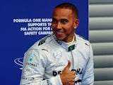 Lewis Hamilton gives the thumbs up after securing pole postion in qualifying for the Belgium GP on August 24, 2013