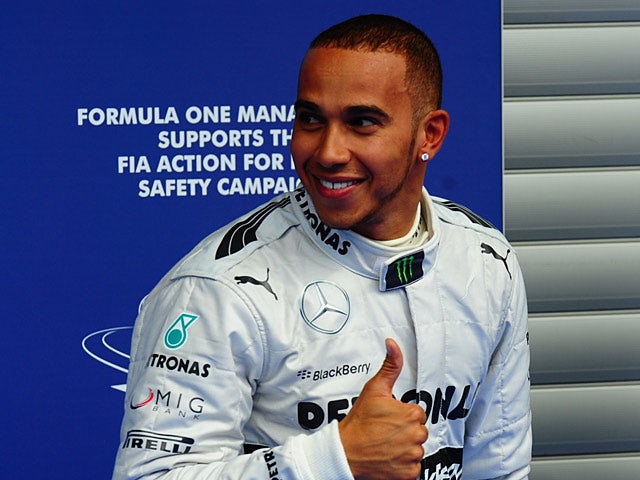 Lewis Hamilton gives the thumbs up after securing pole postion in qualifying for the Belgium GP on August 24, 2013