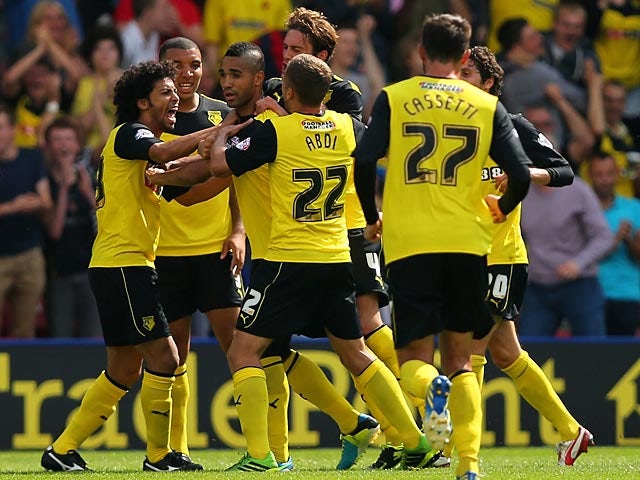 Watford's Lewis McGugan is mobbed by team mates after scoring the equaliser against Forest on August 25, 2013
