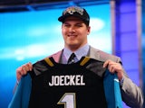 Luke Joeckel of the Texas A&M Aggies holds up a jersey on stage after he was picked #2 overall by the Jacksonville Jaguars in the first round of the 2013 NFL Draft at Radio City Music Hall on April 25, 2013