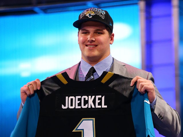 Luke Joeckel of the Texas A&M Aggies holds up a jersey on stage after he was picked #2 overall by the Jacksonville Jaguars in the first round of the 2013 NFL Draft at Radio City Music Hall on April 25, 2013