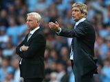 Opposing managers Manuel Pellegrini and Alan Pardew on the touchline on August 19, 2013