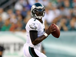 Michael Vick #7 of the Philadelphia Eagles looks to pass in the first quarter against the New England Patriots on August 9, 2013