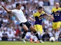 Tottenham's Nacer Chadli and Swansea's Pablo Hernandez battle for the ball on August 25, 2013