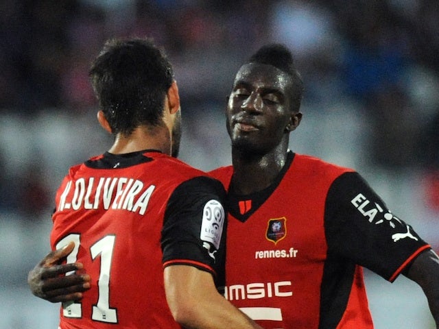 Rennes' Nelson Oliveira is congratulated following a goal against Evian on August 24, 2013
