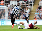 Newcastle's Moussa Sissoko and West Ham's Mark Noble battle for the ball on August 24, 2013