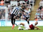Newcastle's Moussa Sissoko and West Ham's Mark Noble battle for the ball on August 24, 2013