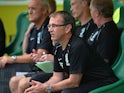 Hibs boss Pat Fenlon sits in the dugout during a game with Motherwell on August 4, 2013