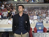 Lyon's French head coach Remi Garde waits before the French L1 football match Lyon (OL) vs. Nice (OGC) on August 10, 2013
