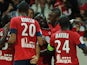 Lille's Salomon Kalou is congratulated by team mates after scoring the opening goal against Saint-Etienne on August 25, 2013