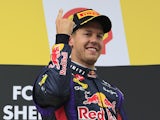 Sebastian Vettel celebrates on the podium after winning the Belgium Grand Prix on August 25, 2013