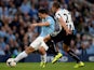 Man City striker Sergio Aguero shoots to score the second goal against Newcastle on August 19, 2013