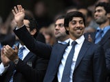 Man City owner Sheikh Mansour waves to fans before a game with Liverpool on August 23, 2010