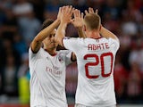 AC Milan's Stephan El Shaarawy celebrates with team mate Ignazio Abate after scoring the opening goal against PSV Eindhoven on August 20, 2013
