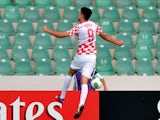 Croatia's forward Stipe Perica celebrates after scoring against New Zealand during a group stage football match between Croatia and New Zealand at the FIFA Under 20 World Cup at Bursa Ataturk Stadium in Bursa on June 29, 2013