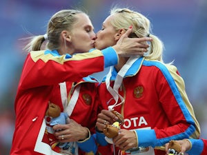 Russian athletes kiss amid anti-gay storm