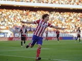 Atletico's Tiago Mendes celebrates a goal against Rayo on August 25, 2013