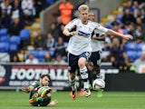 Bolton's Tim Ream and QPR's Charlie Austin battle for the ball on August 24, 2013