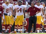 Redskins players stand on the sidelines during a game with Buffalo on August 24, 2013