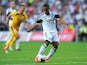 Swansea player Wayne Routledge gets in a shot at goal during the UEFA Europa League play-off first leg between Swansea City and FC Petrolul Ploiesti at Liberty Stadium on August 22, 2013