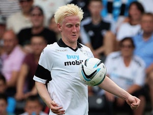 Hughes puts Derby on course for Wembley