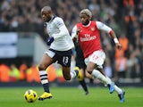 William Gallas of Tottenham is chased by Alex Song of Arsenal during the Barclays Premier League match between Arsenal and Tottenham Hotspur at the Emirates Stadium on November 20, 2010