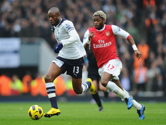 William Gallas of Tottenham is chased by Alex Song of Arsenal during the Barclays Premier League match between Arsenal and Tottenham Hotspur at the Emirates Stadium on November 20, 2010