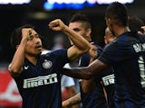 Inter's Yuto Nagatomo celebrates after scoring against Genoa on August 25, 2013