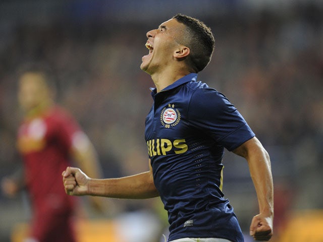 PSV's Zakaria Bakkali celebrates after scoring a goal during the return leg of the third qualifying round match of the Champions League between Belgian First Division football team Zulte Waregem and Dutch team PSV Eindhoven at the Constant Vanden Stock st