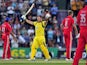 England players look on as Australia's Aaron Finch scores his century during their Twenty20 International cricket match on August 29, 2013