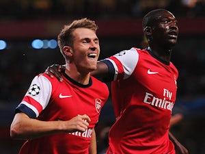 Arsenal's Aaron Ramsey celebrates with team mate Yaya Sanogo after scoring his second goal against Fenerbahce during their Champions League play-off match on August 27, 2013