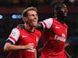 Arsenal's Aaron Ramsey celebrates with team mate Yaya Sanogo after scoring his second goal against Fenerbahce during their Champions League play-off match on August 27, 2013