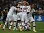 Milan players celebrate a Mario Balotelli goal against PSV Eindhoven on August 28, 2013