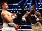 Adrien Broner swings on Paulie Malignaggi during their WBA Welterweight Title bout at Barclays Center on June 22, 2013